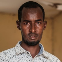 Headmaster, Khadar Mohamud Ibrahim, poses for a photograph in between lessons in Booldid Primary School. Credit: GPE/AP